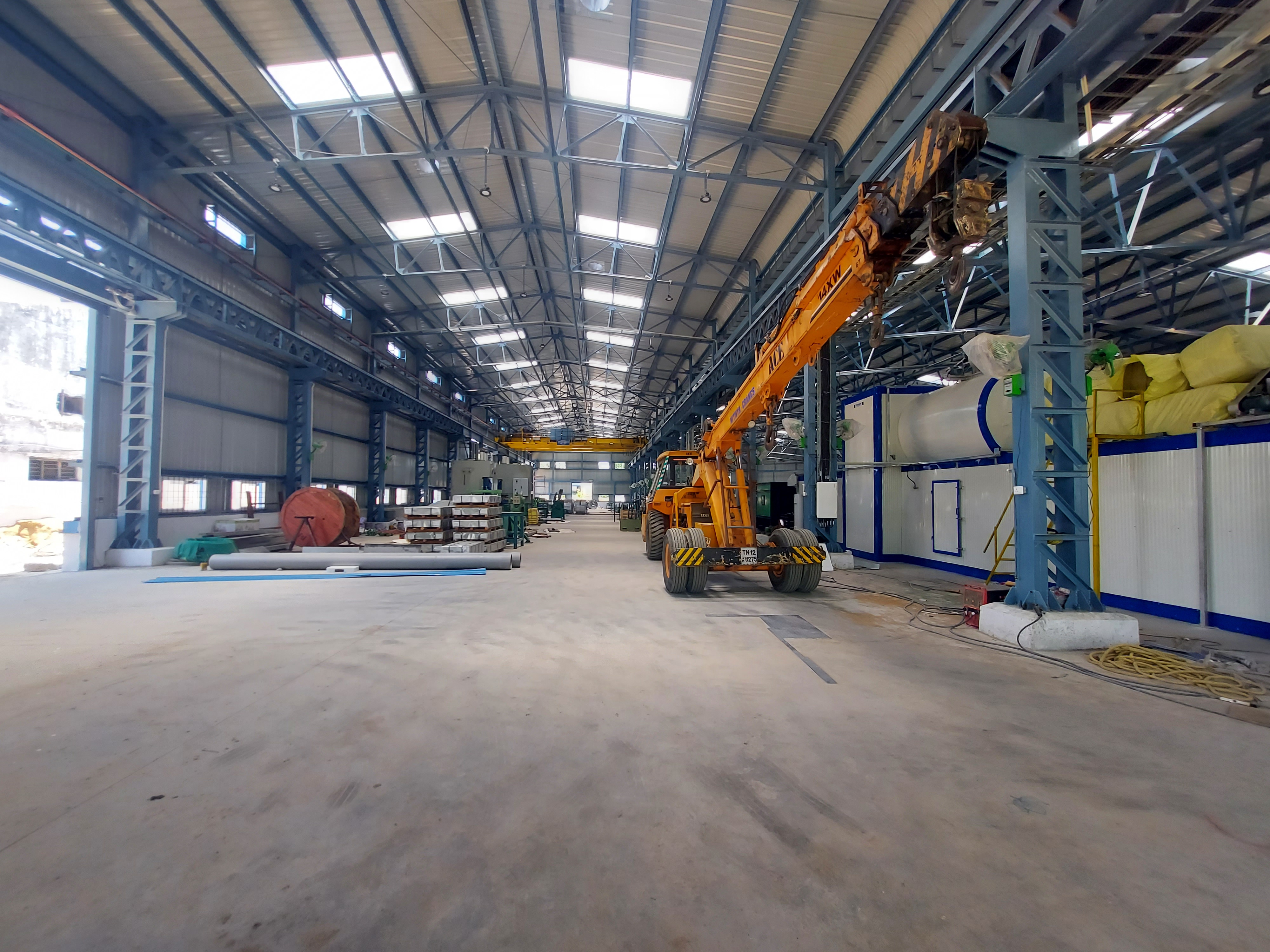 Factory shed interior with crane bay structure