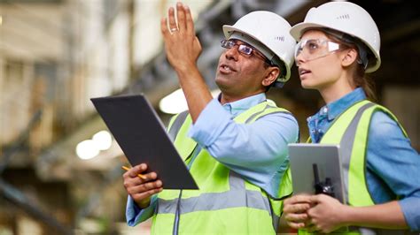 Engineers reviewing project plans